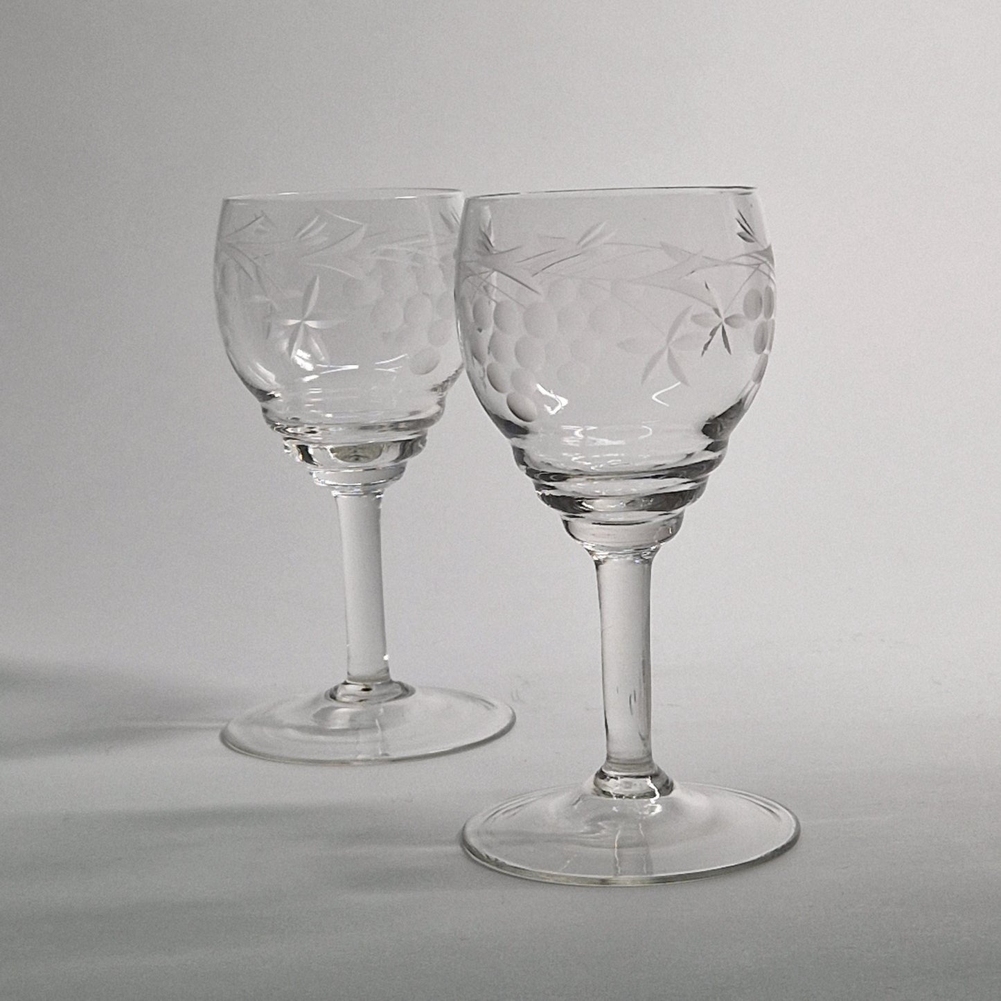 Pair of Vintage Grapes and Leaves etched Wine Glasses.  Late 20th Century.