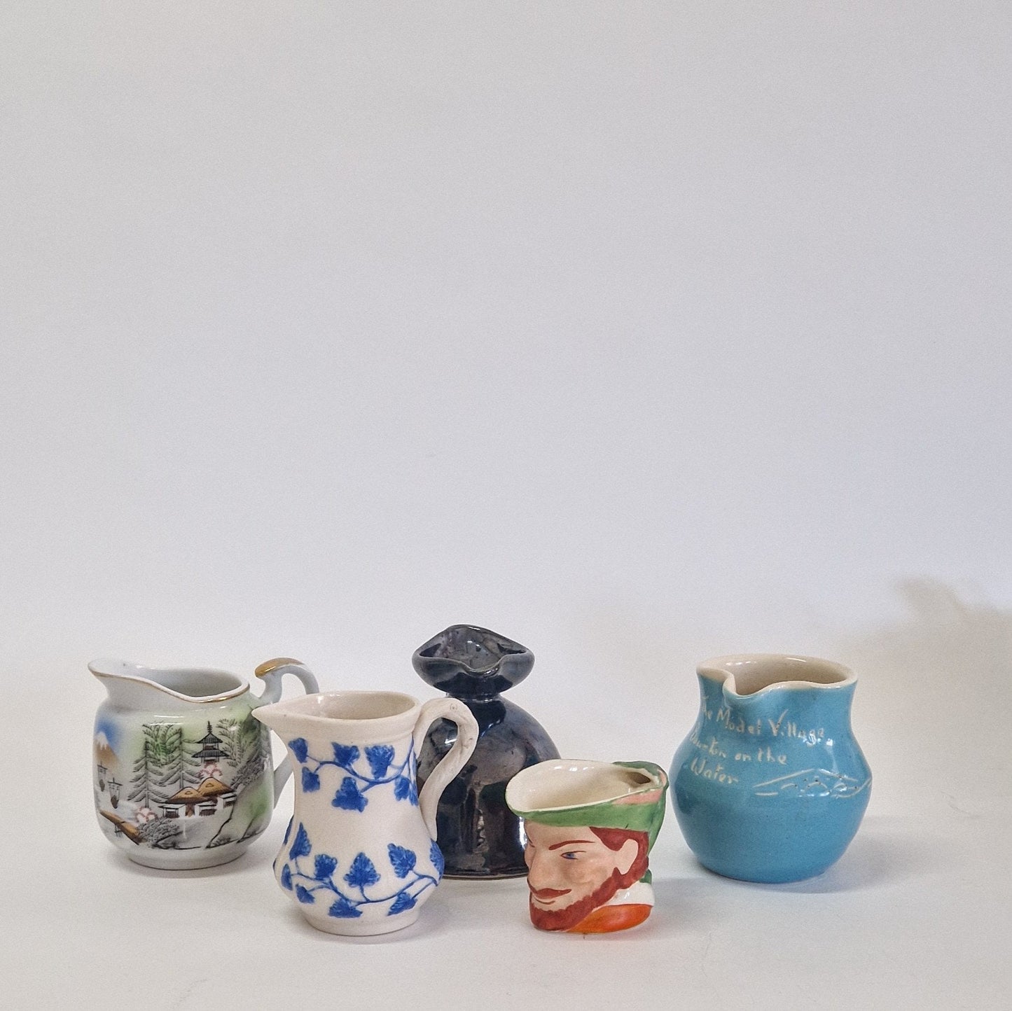Motley Crew of 9 Creamers and Jugs. c1900s - 1950s
