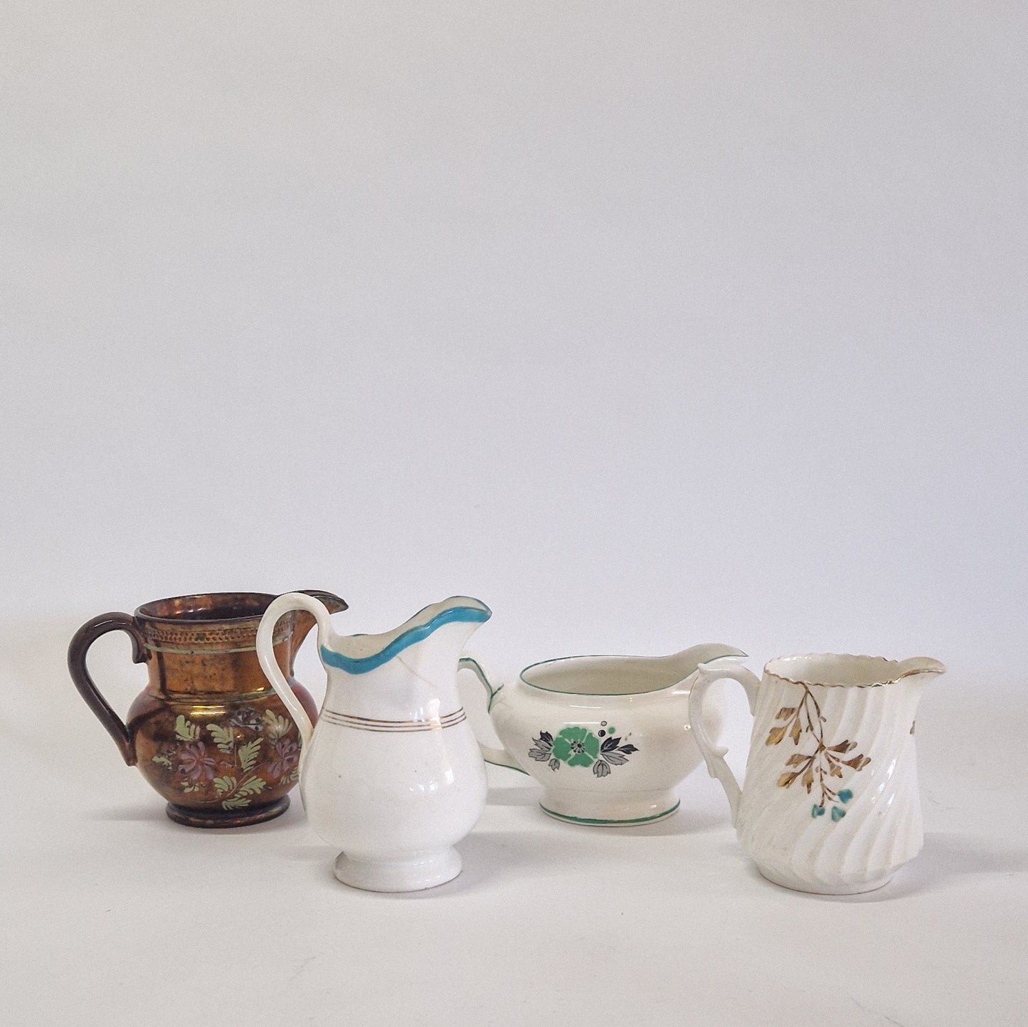 Motley Crew of 9 Creamers and Jugs. c1900s - 1950s