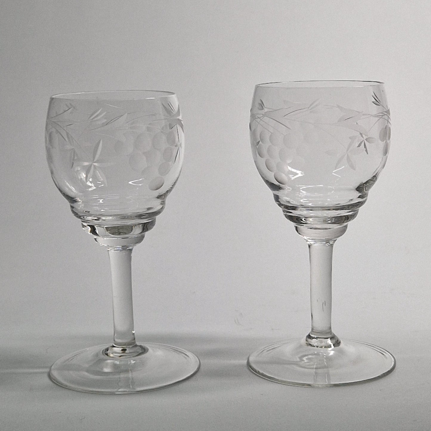 Pair of Vintage Grapes and Leaves etched Wine Glasses.  Late 20th Century.